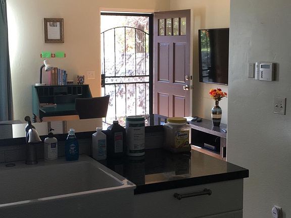 From kitchen looking through living room to front door