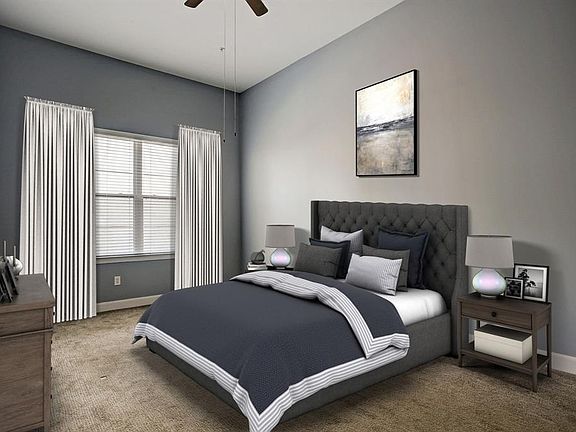 The master bedroom is spacious and can accommodate large scale furniture with ease! The large window brings in a great amount of natural light. This photo has been virtually staged.