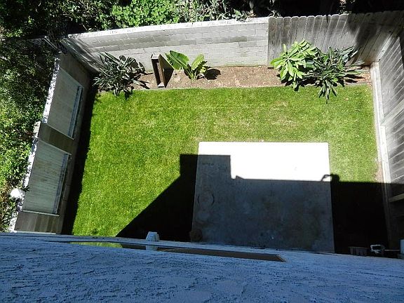 Back yard view from your roof deck