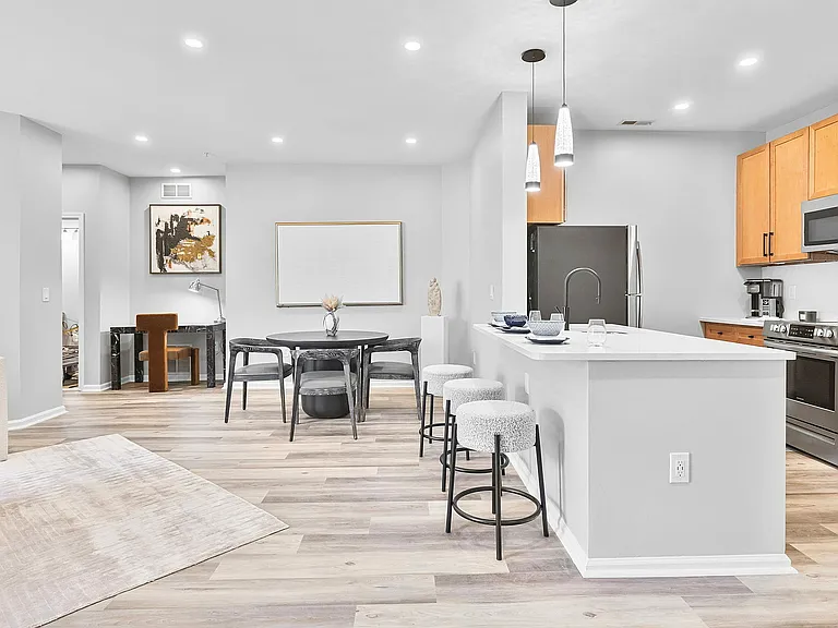 Embrace the elegance of open-concept living with this stylish kitchen and dining area.