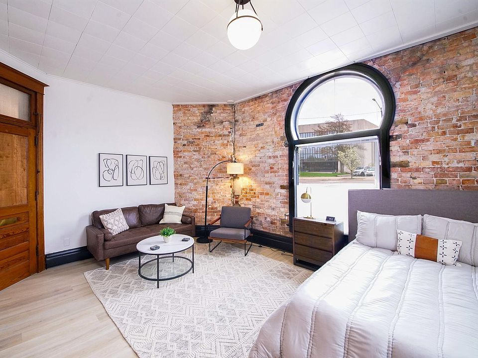 Lots of character and charm. Exposed brick wall, original doors, and large trim.