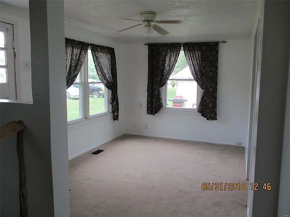Big new windows and ceiling fan in this nice living room
