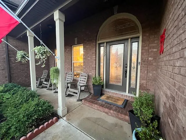 Welcoming covered front porch ideal for morning coffee.