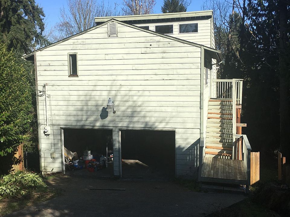 front of house with deck to front door