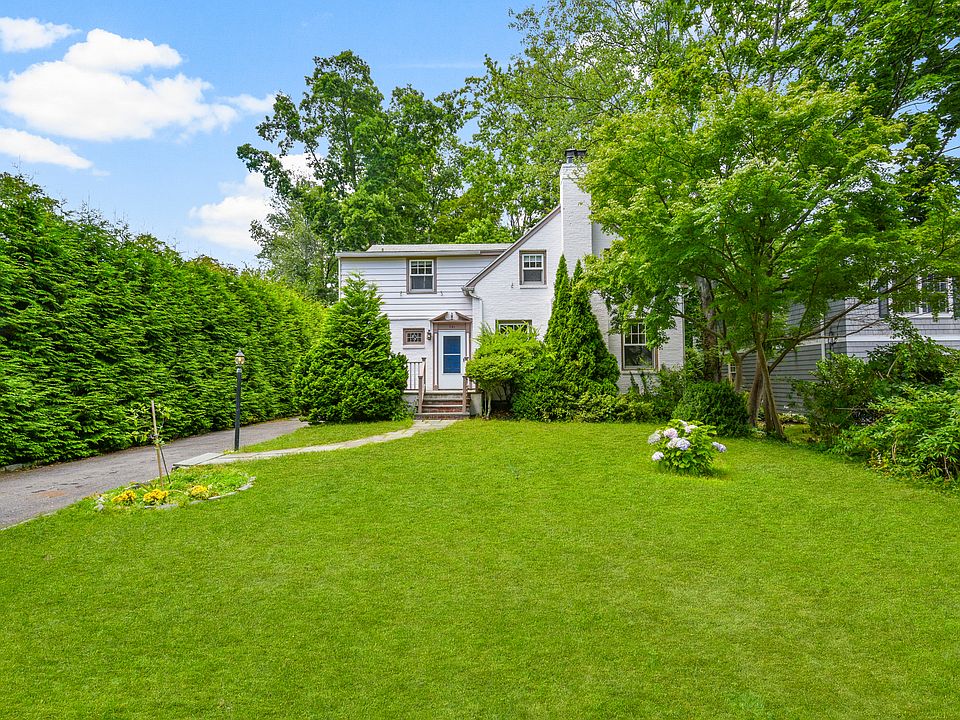 Front of the house with expansive front yard.