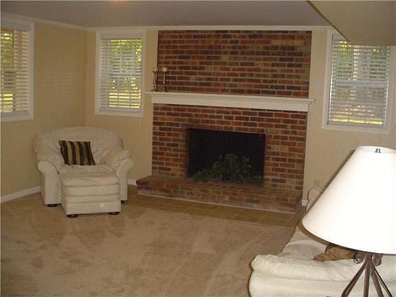 Downstairs living room with wood burning fireplace