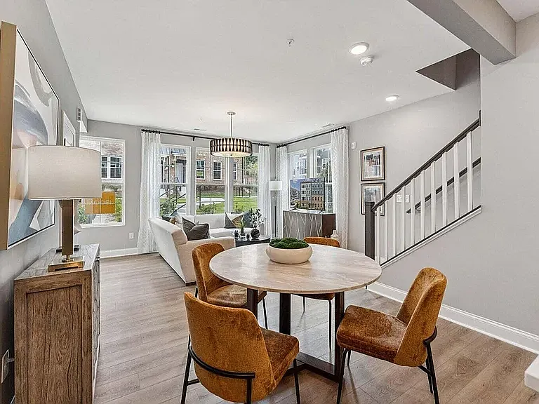 A thoughtfully positioned half-bath adds comfort and functionality to the open-concept main level.