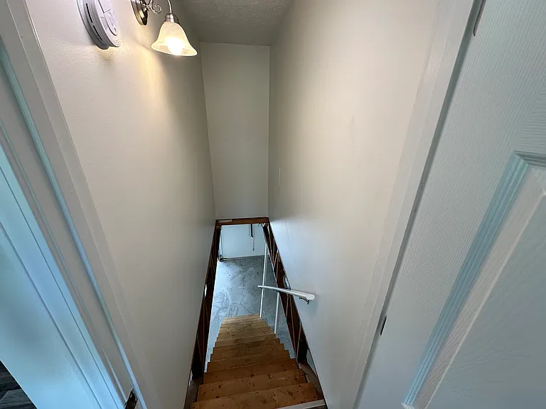 Stairs leading to the basement & 2 car garage