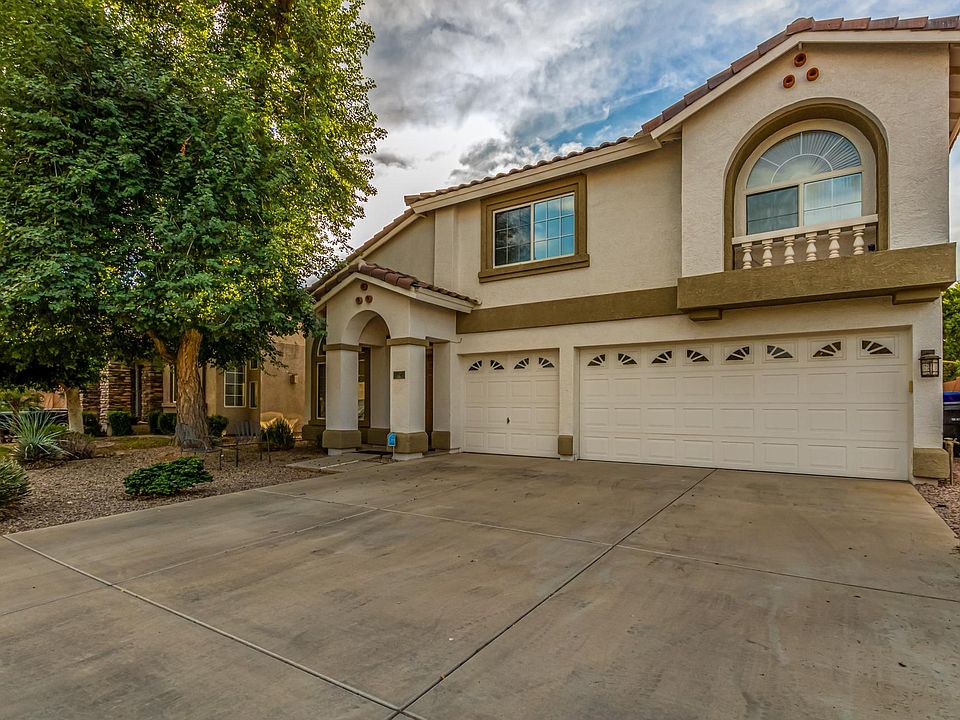 Front of home, with 3-car garage