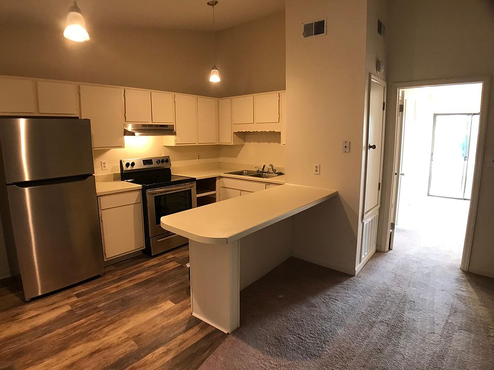 Stainless appliance and open concept kitchen/living room