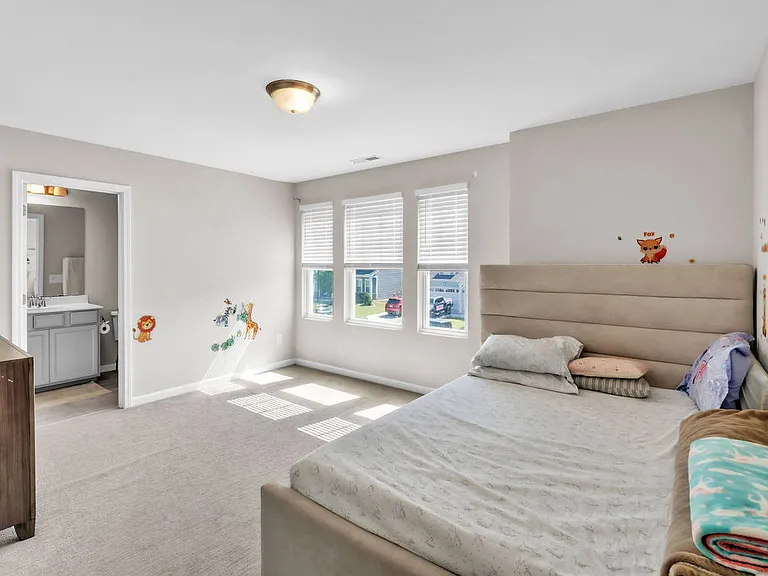 Another bedroom with attached bathroom.