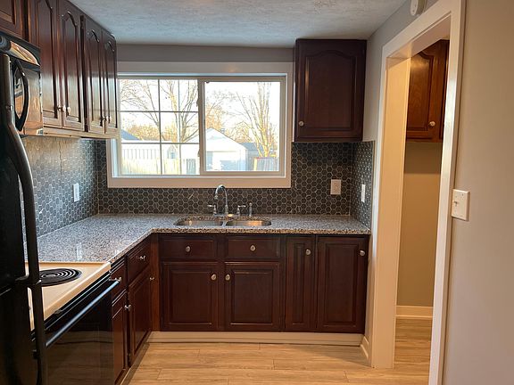 Granite counters tops, octagon tile backsplash, pantry with steel shelfing