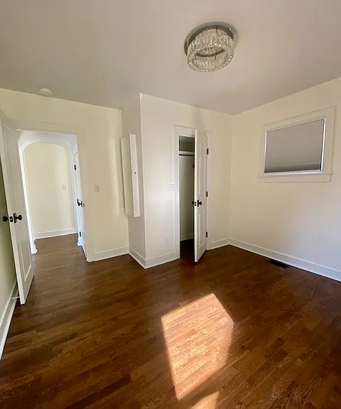 Downstairs bedroom, door to closet area.