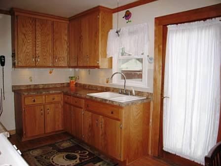Updated kitchen with new cupboards, counters and floor. Walks out to deck.
