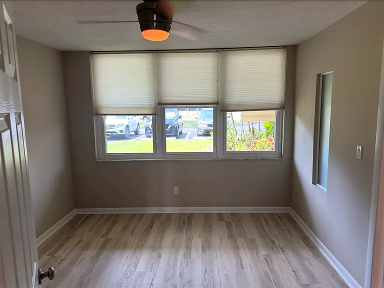 Primary bedroom just painted, new flooring, up-down shades. Inviting space.