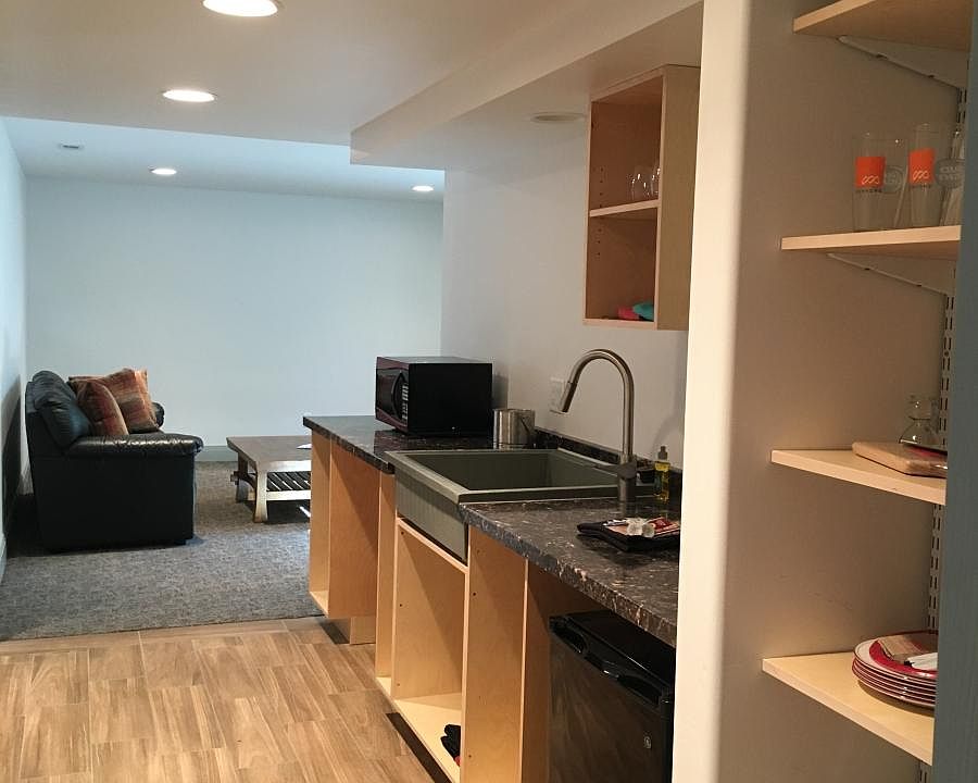 Kitchen with Dual Cooktop full size refrigerator, microwave,
