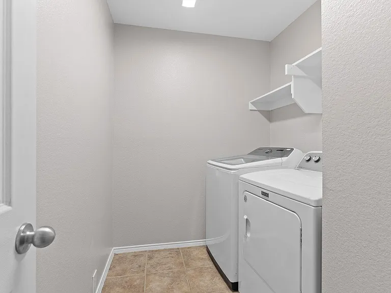 Utility room is spacious and comes with Washer and Dryer