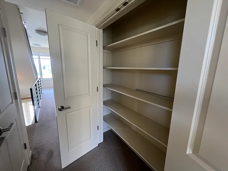 Large linen closet next to laundry