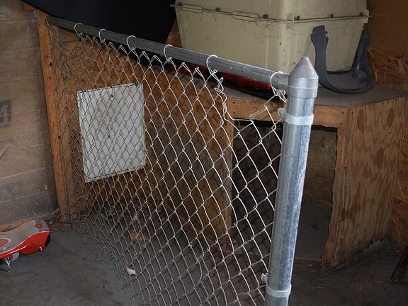In-garage dog kennel w/ door