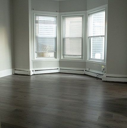 Living area with high ceilings and ceiling fan