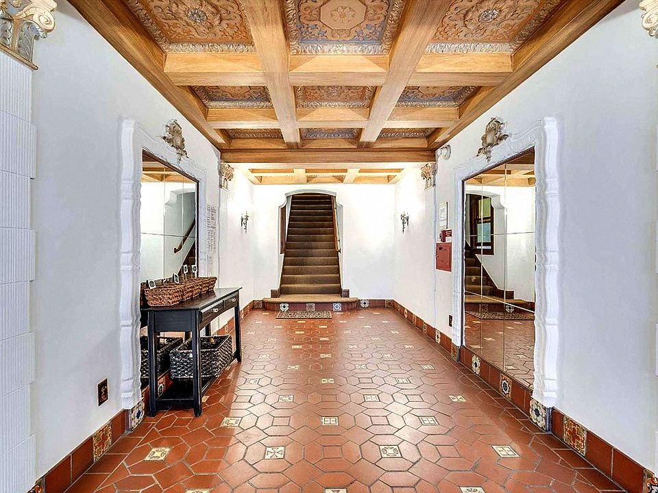 Hallway with a staircase with a wooden banister