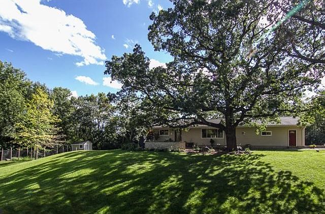 Just across the road from the Stonebrooke Golf Club, this beautiful home sits on 2.8 acres and was c