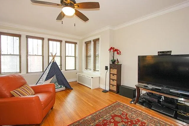 Eight living room windows bring in light from 3 directions