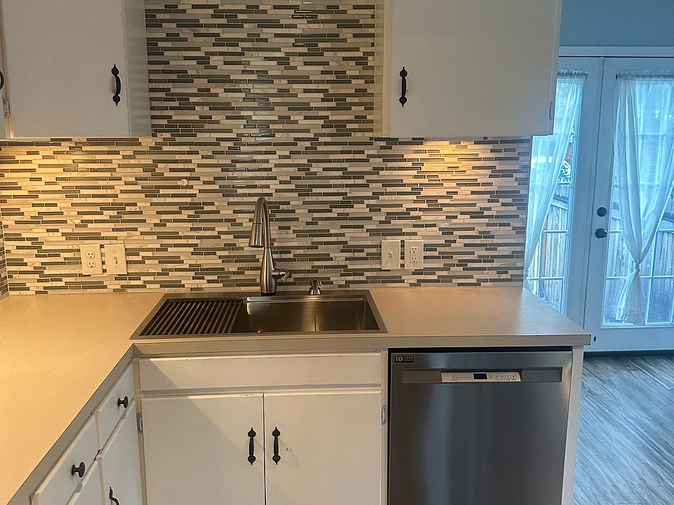 Kitchen features Electric range oven, Microwave, Dishwasher, Refrigerator.