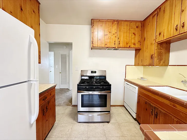 Kitchen is wide enough to fit your sous-chef, and also comes with a dishwasher!