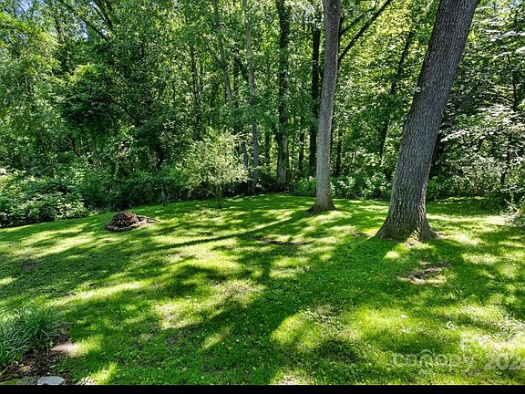 Backyard - Property goes down to a creek that has a trail.