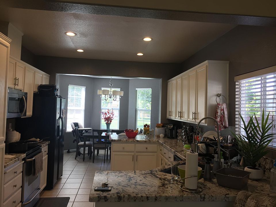 Marble white countertops in kitchen and both upstair bathrooms.