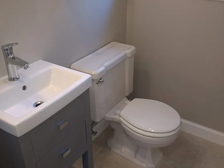 main floor powder room. The window has been replaced with a new one.