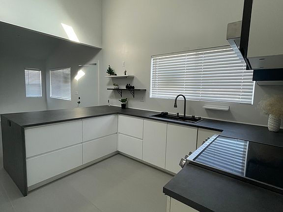 New tile flooring and kitchen cabinets.