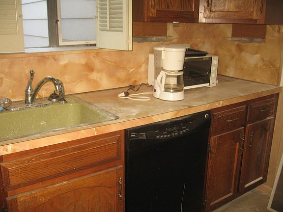 KITCHEN WITH REFRIGERATOR. DISHWASHER, ELECTRONIC GAS RANGE AND BUILT-IN MICROWAVE