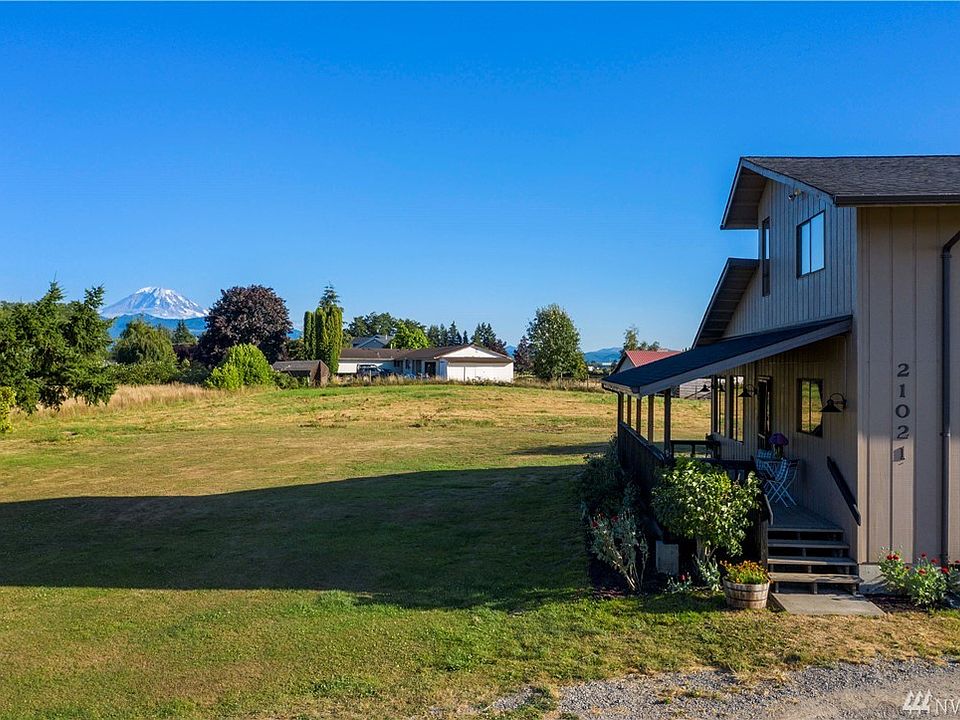 Enjoy picturesque Mt Rainier views from this refreshed home situated on shy 5 acres surrounded by open space and pasture