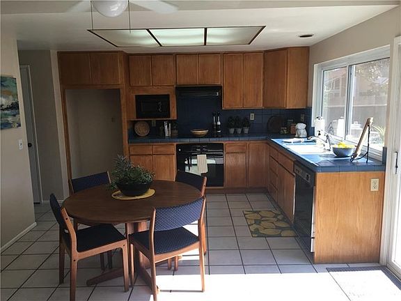 Open Kitchen with pass thru window to the backyard for those BBQ nights.