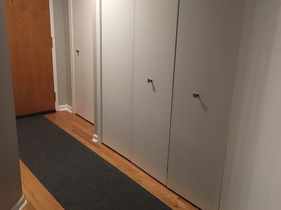 front entry way with closet and utility room