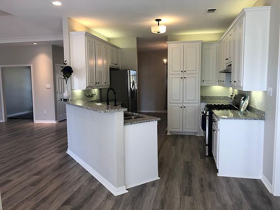 Kitchen has been completed renovated with new granite countertops and stainless steel appliances including gas stove.