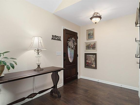 As you step in to your new home you are welcomed by a lovely foyer with an updated light fixture, a coat closet and room for an entry bench or your favorite entry piece.