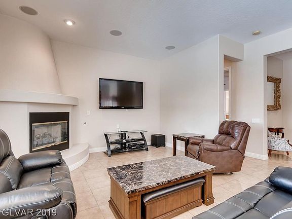 Open great room with fire place, surround sound, tile floors. Master bedroom to the North of the home