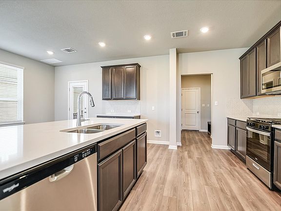 This spacious kitchen is great for cooking with family and friends.
