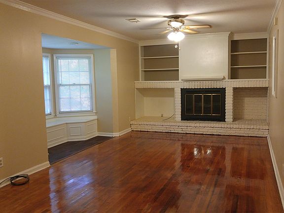 Living room with wood burning fireplace