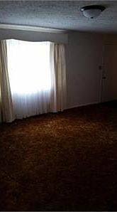 View from kitchen doorway to living room and front door