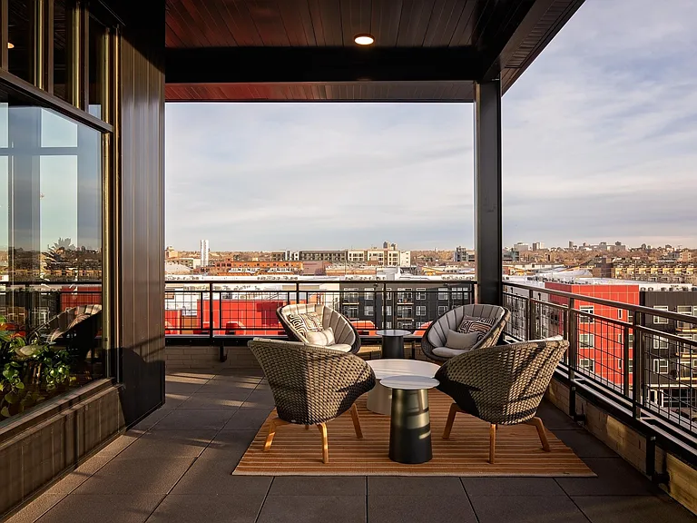 Rooftop lounge featuring ample social spaces
