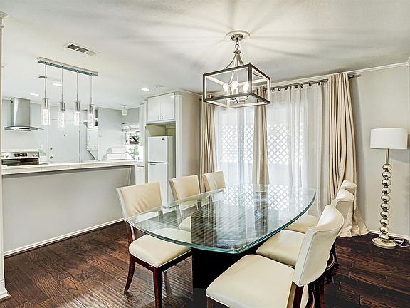 Additional view of dining area open to kitchen and with access to outdoor space.