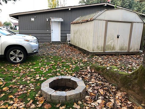 Back entrance and storage shed