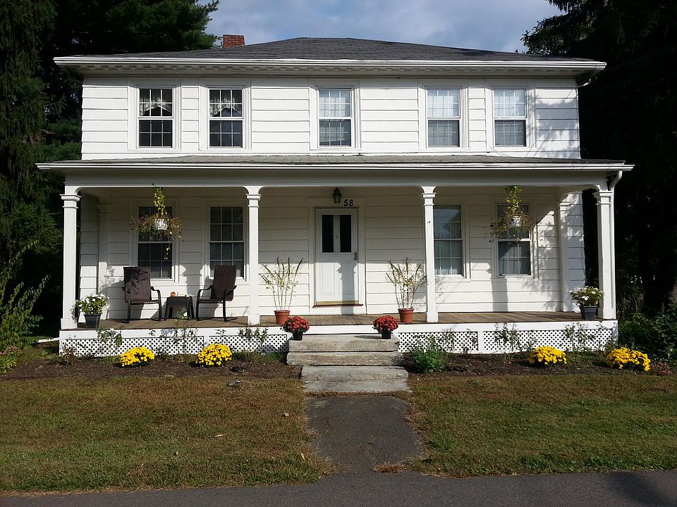 Colonial House. Apt. is top two left windows.
