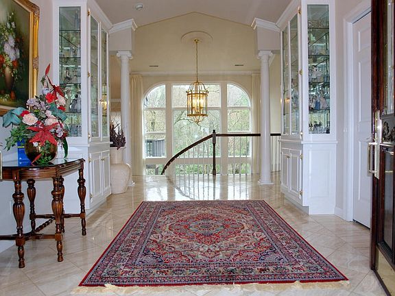 Grand entry with two story windows