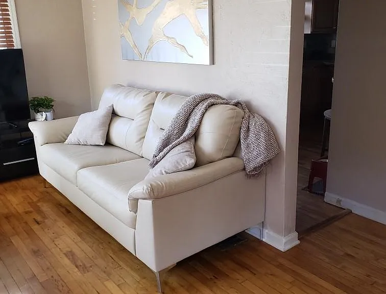 Living area. The kitchen is to the left of the entry. All the wood floors are original.