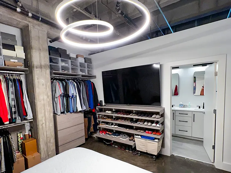 Bedroom with custom storage solutions from the Container Store.